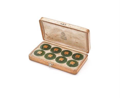 FABERGÉ, A BOXED SET OF EIGHT NEPHRITE AND GOLD GAMING TOKENS  ST. PETERSBURG, CIRCA 1900  Each polished nephrite disc applie