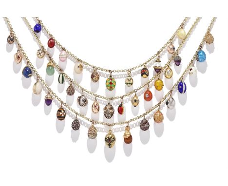 AN ENAMEL AND GEM SET EGG PENDANT NECKLACE  INCLUDING BY WORKMASTERS FEDOR AFANASIEV AND AUGUST HOLLMING, CIRCA 1890-1910 AND