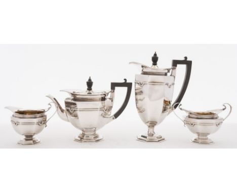 A George V silver four-piece tea service, maker Roberts & Belks, Sheffield, 1917: of octagonal tapering form, raised on an oc