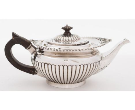 A Victorian silver teapot, maker William Hutton & Sons, London, 1896:, of squat circular form with domed hinged lid, gadroone