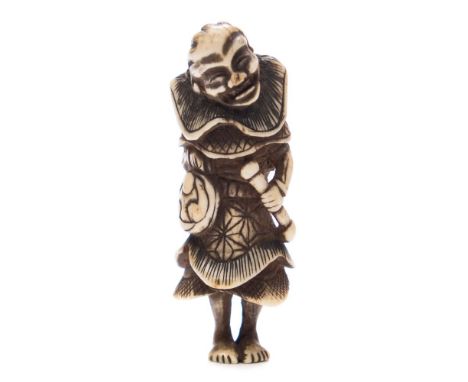 A Japanese carved bone netsuke: of a man wearing a large collar and holding a staff and bag, probably late 18th Century, 7 cm