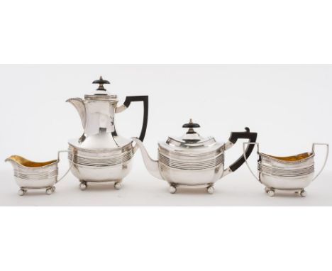 An Edward VII silver four-piece tea service, maker Thomas Bradbury & Sons, London, 1902: of barge-shaped outline, with gadroo