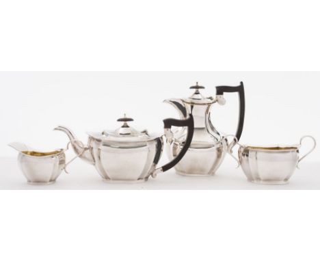A George V silver four-piece tea service, maker Emile Viner, Sheffield, 1927: of barge -shaped outline, with canted corners a