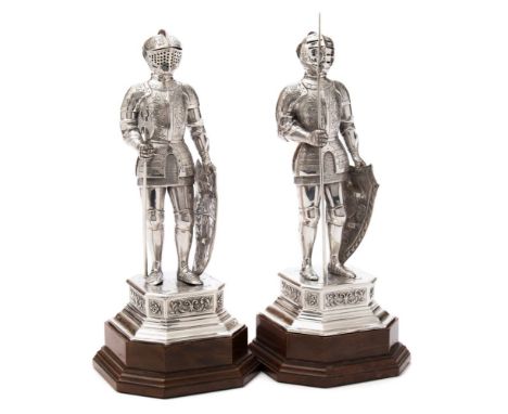 A pair of German silver figures of knights in  armour, bears import marks for Adolph Barsach Davis, London, 1928: each wearin