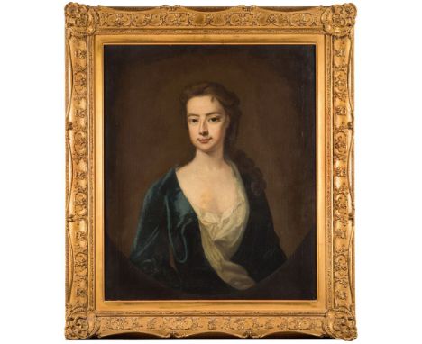 Follower of Godfrey Kneller [1646-1723]-A portrait of a young lady:-bust-length, with long curling brown hair and wearing a w