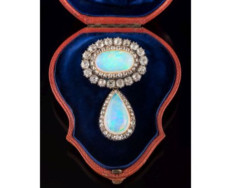 A mid 19th century opal and diamond cluster brooch: the oval opal approximately 19.3mm x 11.3mm, within a surround of cushion