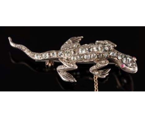 A late 19th century gold, silver and diamond 'lizard' brooch: pave-set with old brilliant-cut diamonds and cabochon ruby eyes