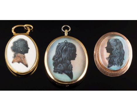 An oval silhouette portrait of a young girl, 36mm long, in a 9ct gold frame, the reverse inscribed 'By Marcelle D Shears', a 