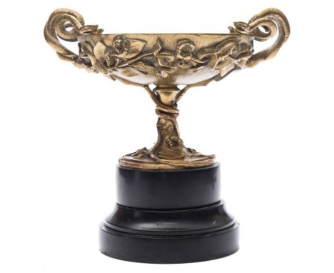 A Continental gilt bronze pedestal dish: of circular form, the handles formed from entwined serpents, the exterior modelled w