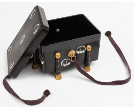 A Japanese black lacquer and mother of pearl inlaid karabitsu: the rectangular box with lift-off lid, inlaid with mother-of-p