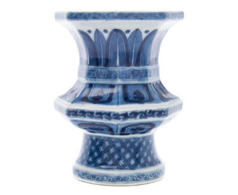 An unusual Chinese porcelain stand: of octagonal baluster form with quadrilobed opening, the flanks painted in blue with lapp