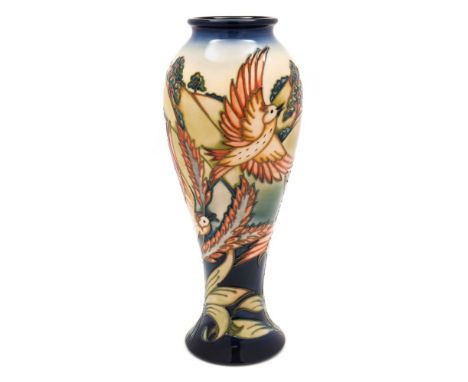 A Moorcroft pottery vase: of slender baluster form tubelined in the Lark Ascending pattern after the original by Philip Gibso