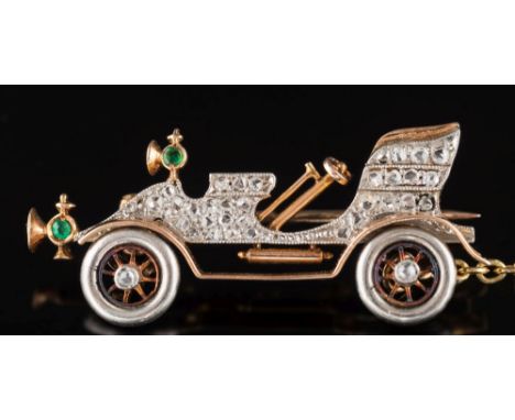 An Art Deco rose diamond and emerald-set vintage 'De Dion' style motor car brooch: pave-set with rose cut diamonds to the bod