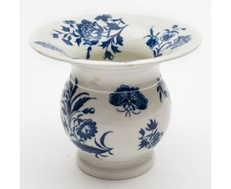 A First Period Worcester porcelain spittoon: printed in blue in the Three Flowers pattern, hatched crescent mark, circa 1770-