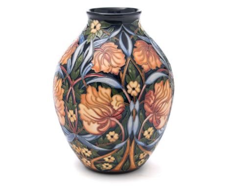 A Moorcroft pottery vase: of oviform tube lined in the Shepherds Clock pattern after the original by Rachel Bishop, with prof