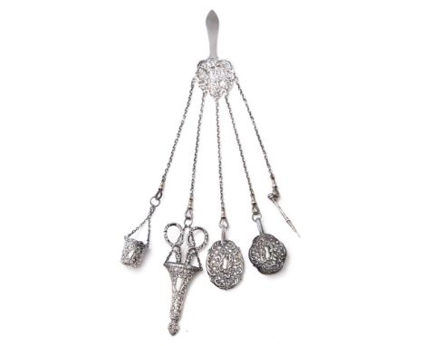 A late Victorian silver chatelaine, maker R. & W., Birmingham 1900/1901: comprising a central clip, scissors, notepad, propel
