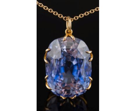 A large cushion-shaped synthetic sapphire mounted pendant: the synthetic sapphire 24mm x 18mm in a bifurcated claw setting on