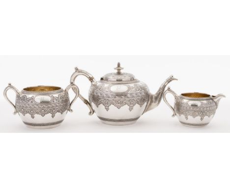 A Victorian Scottish silver three-piece tea service, maker JR, Glasgow, 1876: initialled, of circular form with banded foliat