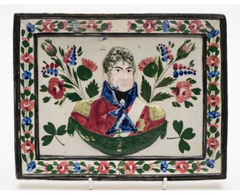 A Portabello pottery 'George IV' commemorative plaque: relief moulded and painted in pink, black, blue, yellow and green enam