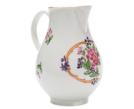 A First Period Worcester sparrow beak cream jug: of baluster form with grooved loop handle, painted with a floral spray withi