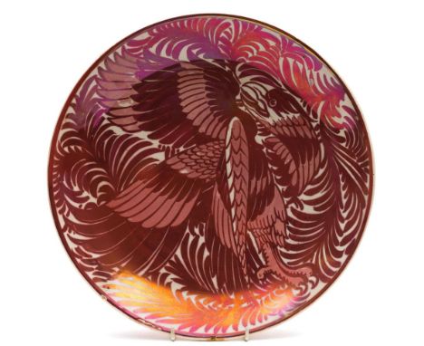 Attributed to William de Morgan, a lustre dish: of shallow circular form painted in ruby lustre with an eagle amongst feather