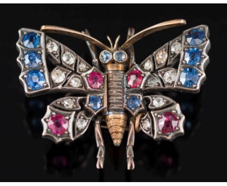 A late 19th century gold, ruby, sapphire and diamond butterfly clip: with hinged and sprung outstretched wings 33mm wingspan.