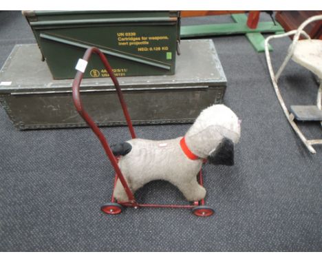 A Chiltern Toys plush dog on Push-Along frame