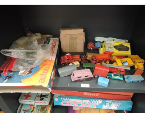 A shelf of playworn diecasts including Dinky Centurion Tank, boxed 651, Corgi. Matchbox etc