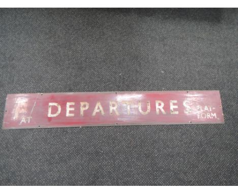 A BR enamel sign, Departures At Platform, in maroon with white lettering