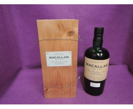 A bottle of Macallan The 1874, Pure Highland Malt Scotch Whisky, Selected by Whisky Makers, F A Newlands at the Macallan Dist