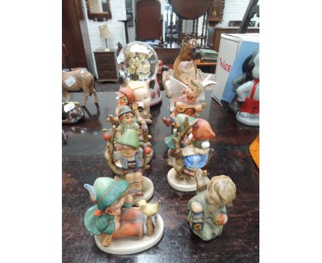 Twelve Goebel figures and collectables including Latest News, Pig Money Box, Snow Globe etc