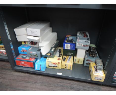 A shelf of Corgi (China) diecasts including Heavy Haulage, Classics, Passage Of Time etc, all boxed (22)