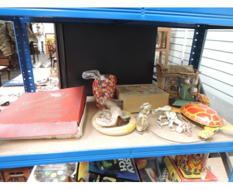 A shelf of vintage toys including a Moko Muffin Juinor string puppet, Chad Valley Kiddies Gramophone, Little Betty Sewing Mac