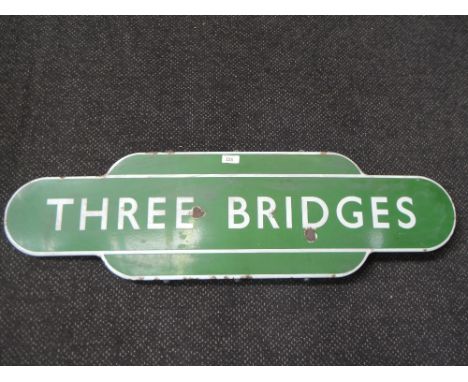 A Green Enamel Totem Sign, Three Bridges having white lettering and borders