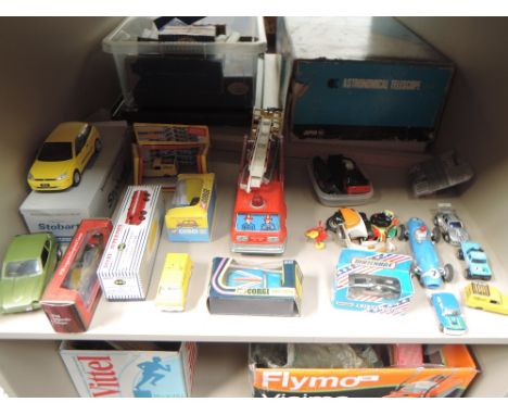 A shelf of mixed vintage and reproduction diecasts including Corgi Mini 1000, boxed 200, Dinky (china) Esso Tanker, boxed 943