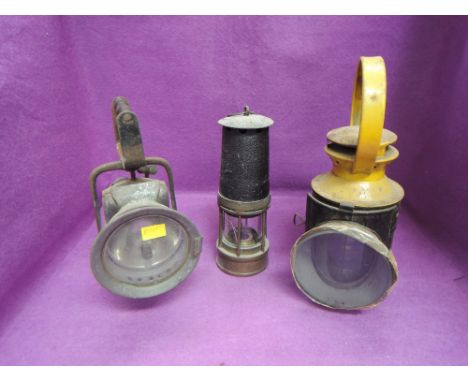A BR (M) Tri-Colour Signal Oil Lamp, a gas hand lamp and a miner's oil lamp