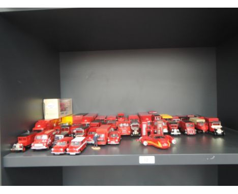 A shelf of Corgi and similar diecast Royal Mail vehicles and accessories, approx 40 along with a bag of empty boxes