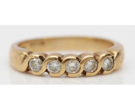 A 9ct gold and brilliant cut diamond five stone ring, I, 2.4gm 