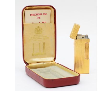 Dunhill, a gold plated Rollagas lighter, case, instructions. 