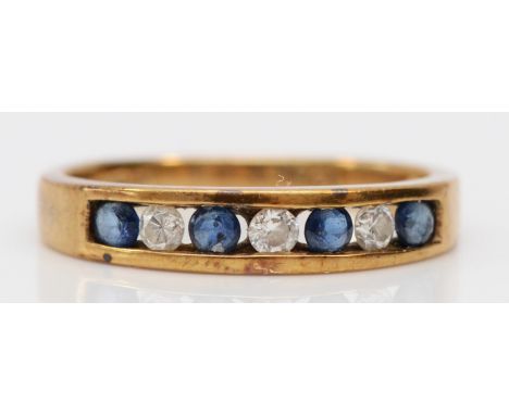 A 9ct gold sapphire and brilliant cut diamond seven stone ring, K, 1.8gm 