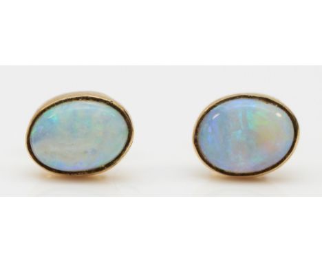 A 9ct gold pair of opal ear studs, 1.3gm, probably doublets 