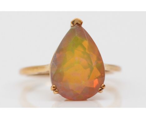 A 9ct gold and facetted pear shape opal single stone ring, 14 x 10mm, L 1/2, 2.4gm 