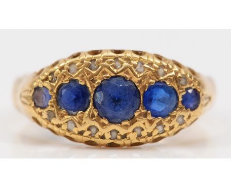 An Edwardian 18ct gold sapphire and diamond chip boat shape ring, later stamped 18ct, probably a replacement shank, M, 2.8gm 