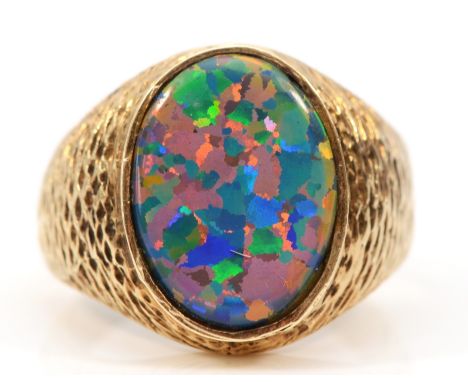 An unmarked 9ct gold and black opal doublet/triplet gentleman's signet ring, stone 18 x 14mm, textured shoulders, Y, 6.8gm