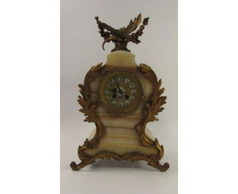 A French late 19thC marble and gilt metal mantel clock, of baluster form, enamel dial bearing Arabic numerals, eight day move