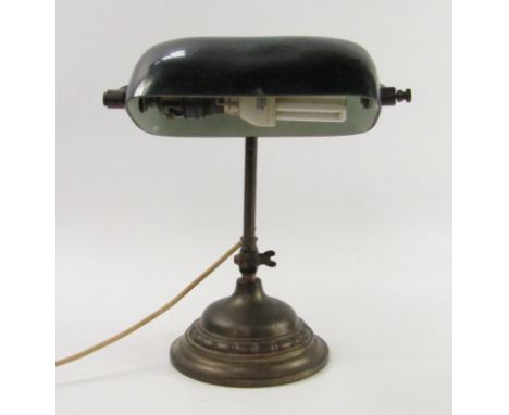 A brass and cast iron angle poise table lamp with a green glass shade, 34cm high.