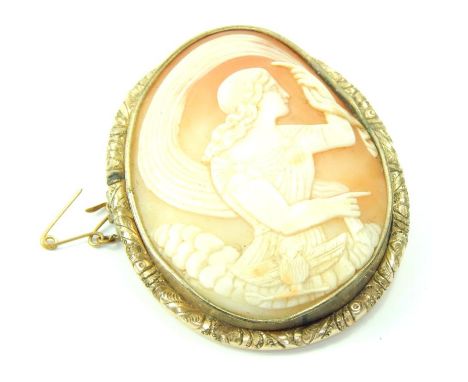 A Victorian shell cameo brooch, depicting Athena and the owl, in an oval chased yellow metal surround, with safety chain as f
