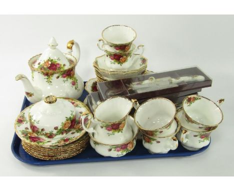 A Royal Albert porcelain part tea service, decorated in the Old Country Roses pattern, comprising tea pot, milk and sugar bow