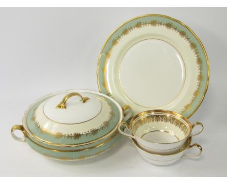 An Aynsley porcelain part dinner service, decorated with gilt leaves against ivory and pea green bands, pattern no 8013, comp