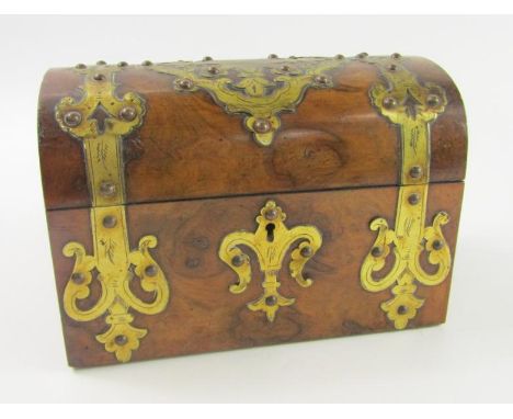 A Victorian walnut domed twin division tea caddy, with brass strapwork and key escutcheon, 23cm x 13cm x 16cm.